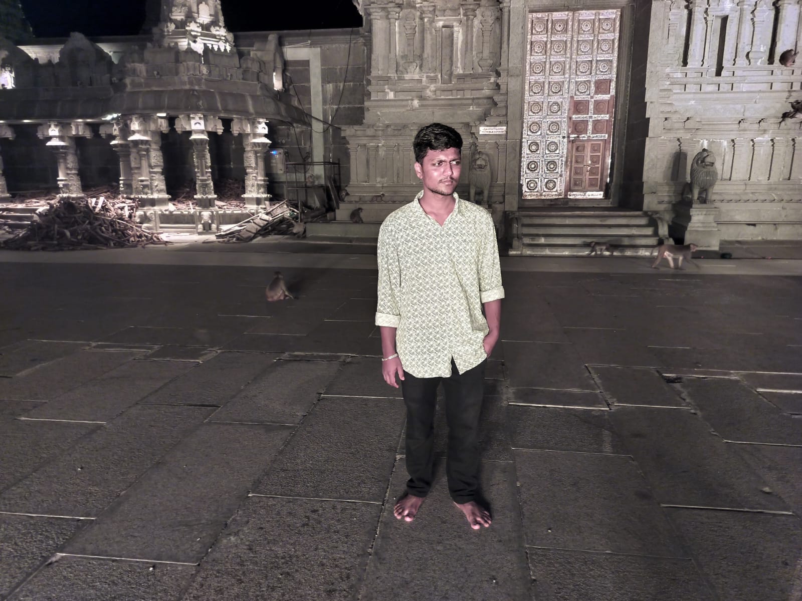Standing poised before the temple sanctuary doors